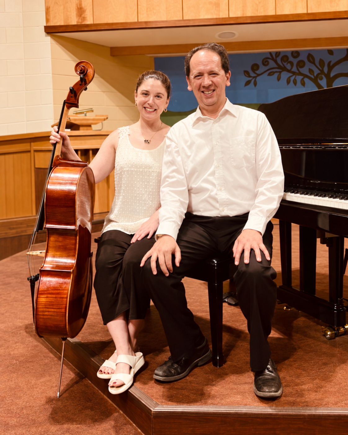 Danielle with her cello and Robert beside the piano